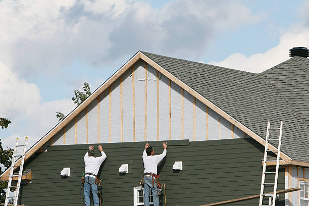 Professional Storm Damage Siding Repair technician working in Olney, IL